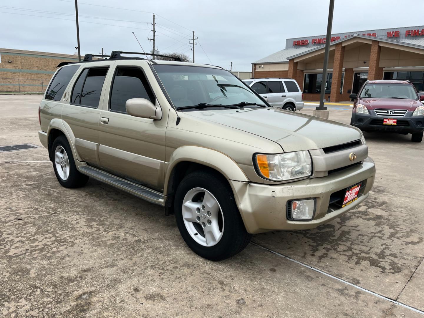 2003 tan /TAN Infiniti QX4 4WD (JNRDR09Y53W) with an 5 engine, 4-Speed Automatic Overdrive transmission, located at 14700 Tomball Parkway 249, Houston, TX, 77086, (281) 444-2200, 29.928619, -95.504074 - Photo#0